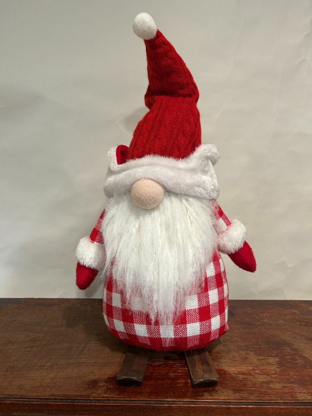 Christmas Holiday Gnome with red knit cap, red plaid torso, wispy white beard